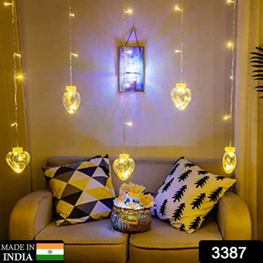 Close-up of warm white heart-shaped LED wish balls