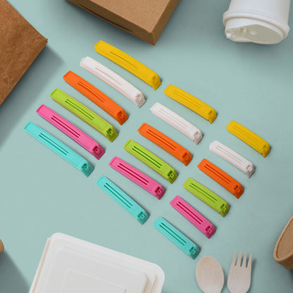 A hand sealing a snack bag with a blue airtight food clip.