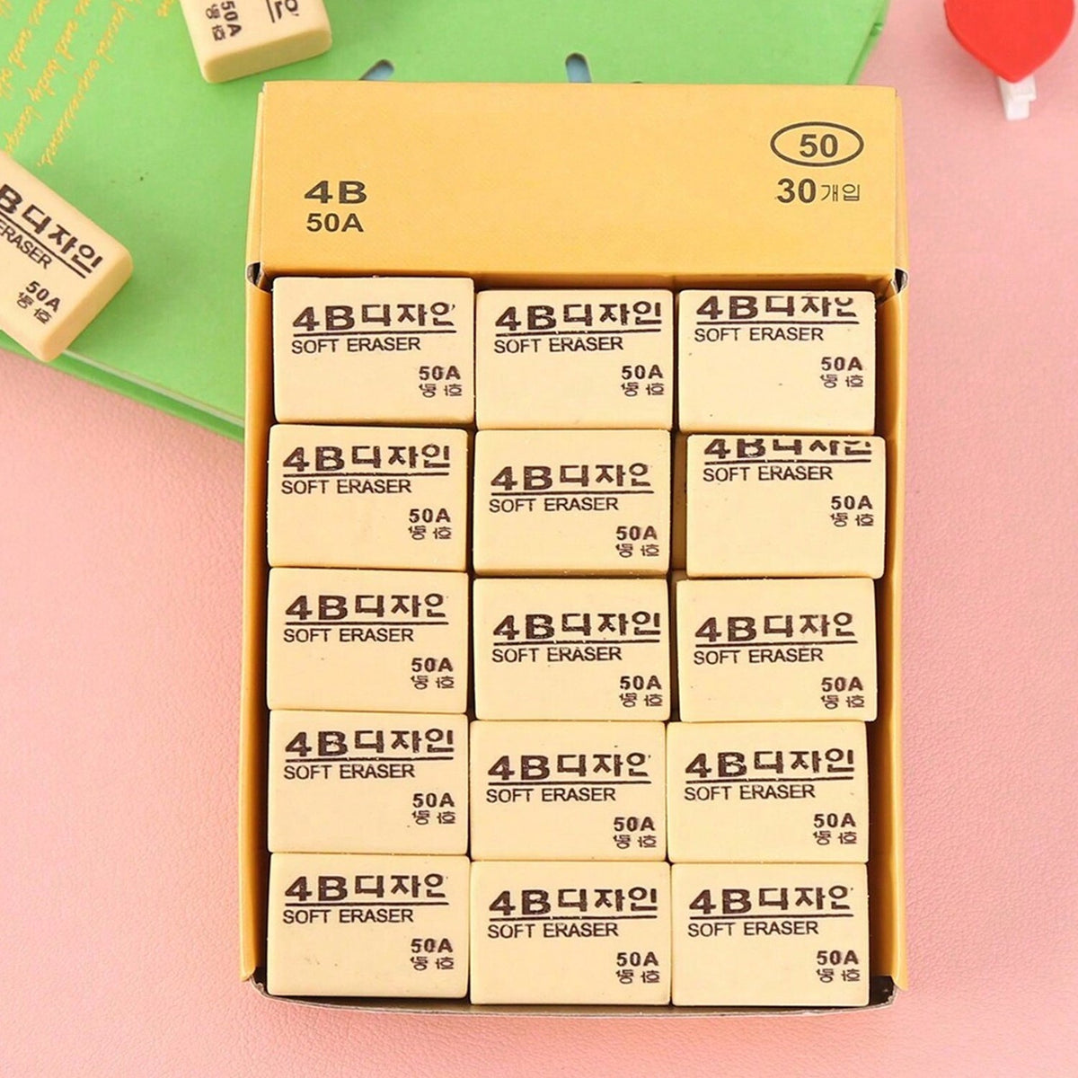 Thirty bright yellow 4B erasers neatly packaged for students and office use.