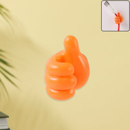 Orange hand-shaped silicone wall clip holding charging cables securely