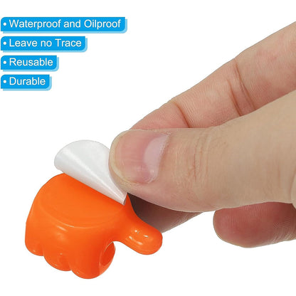 Empty orange hand-shaped silicone wall clip for organizing essentials