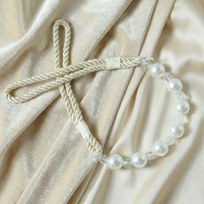 Stylish window drapery tieback featuring pearl beads