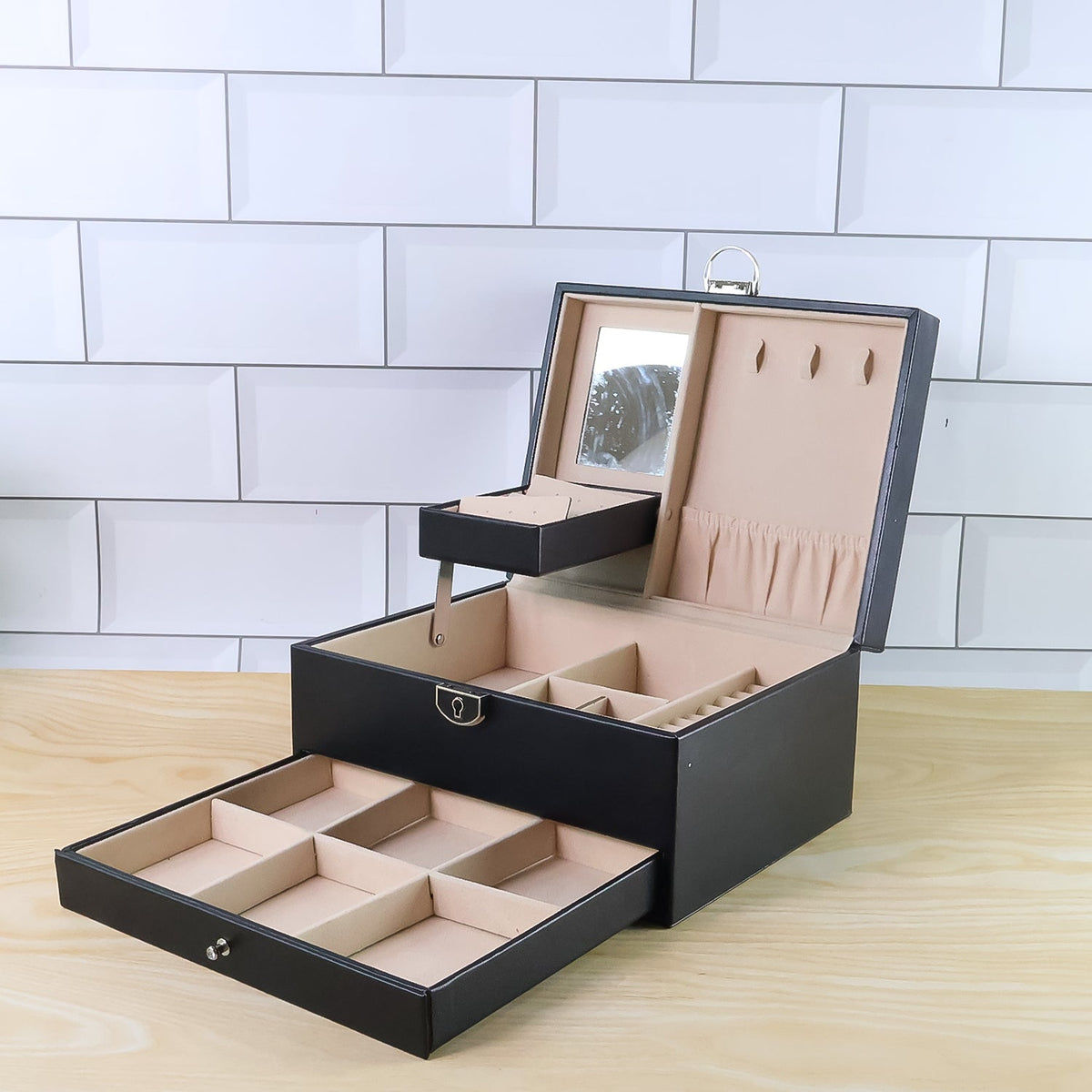 Compact jewellery organizer box showcasing its full-width sliding drawer.