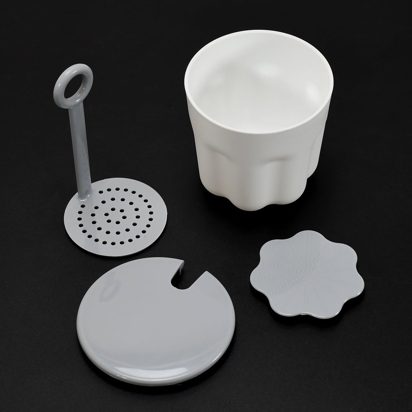 Instructions demonstrating how to add facial cleanser and water to the Foaming Cleanser Shaker.