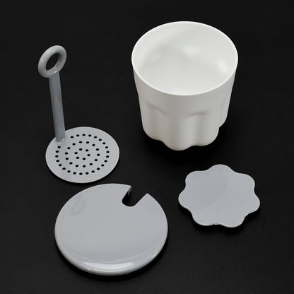 Instructions demonstrating how to add facial cleanser and water to the Foaming Cleanser Shaker.