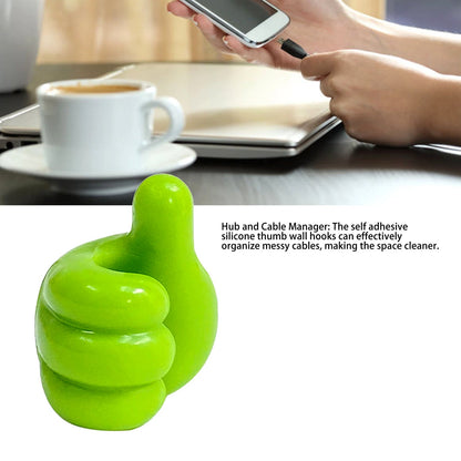Key clipped securely on green hand-shaped wall holder