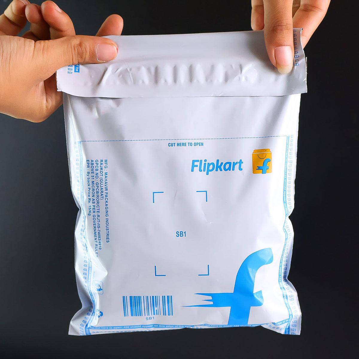 Tamper-proof adhesive seal on a Flipkart big size courier bag