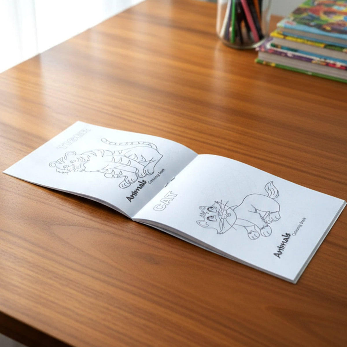 Open colouring book showing animal outlines for children’s activity