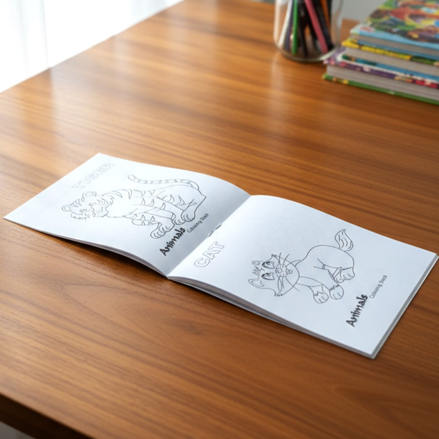 Open colouring book showing animal outlines for children’s activity