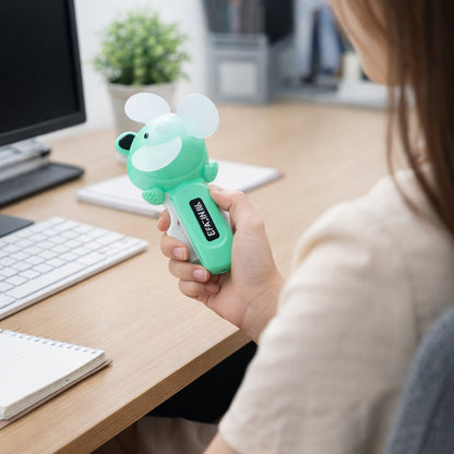 Smooth rotating blades of mini handheld fan for quiet airflow