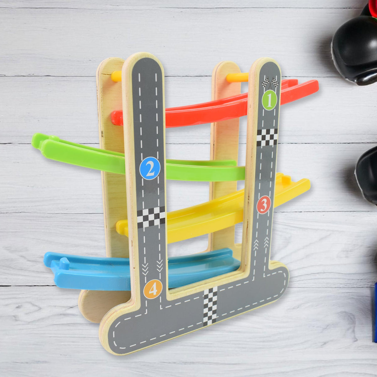 Close-up of the smooth wooden ramps and vibrant mini cars of the play set.