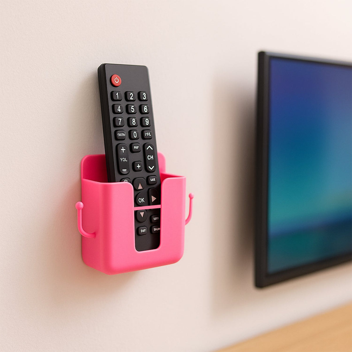 Four pieces of wall mounted remote holders in a clean, minimalist setting.