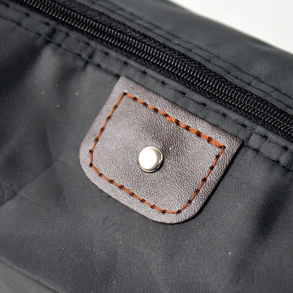 Handheld travel bag designed for toiletries and personal care essentials