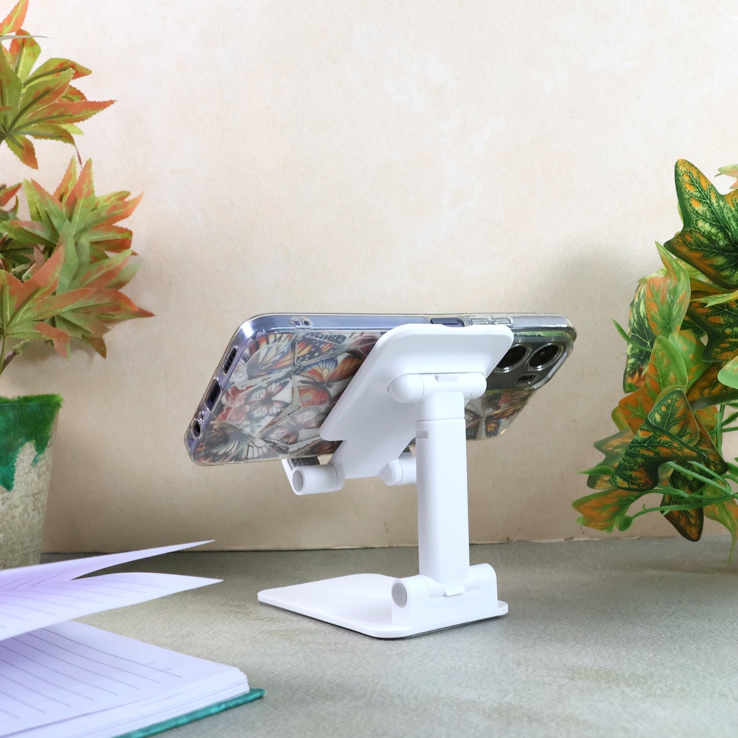Adjustable phone stand with anti-slip silicone pad and foldable design