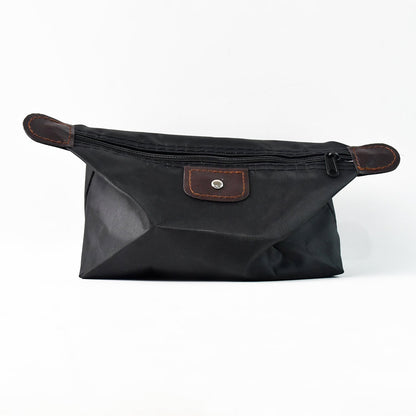Travel shoulder bag in stylish black waterproof fabric for grooming kits