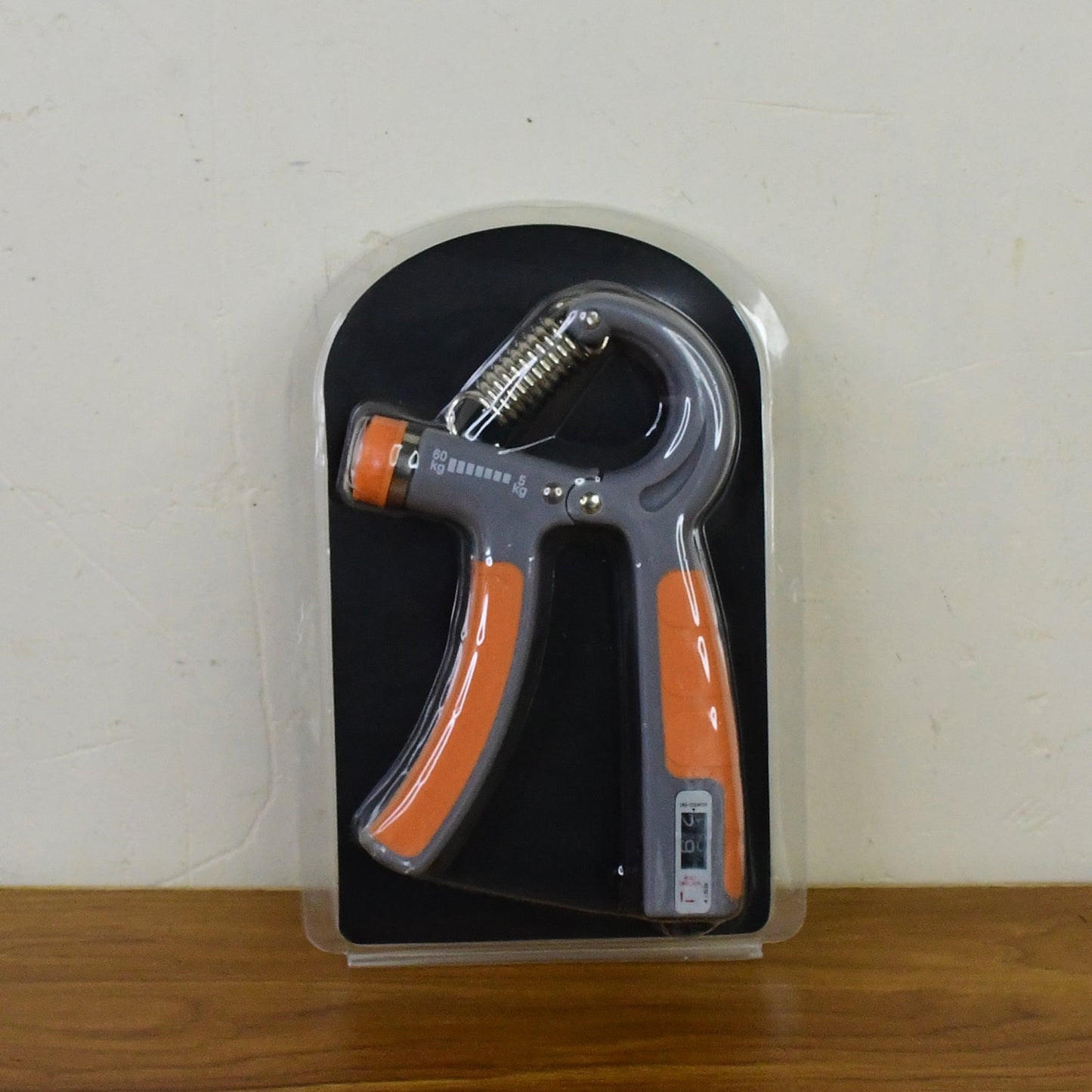 Durable hand grip strengthener with steel spring and ergonomic handles for fitness