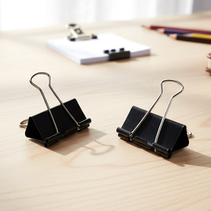 Close-up view of a black 25mm binder clip clasp
