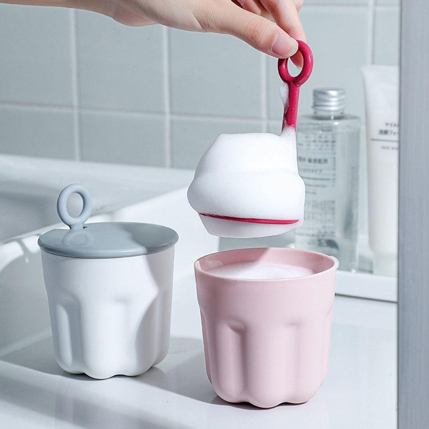 The Foaming Cleanser Shaker disassembled, showing its easy-to-clean components for hygienic use.