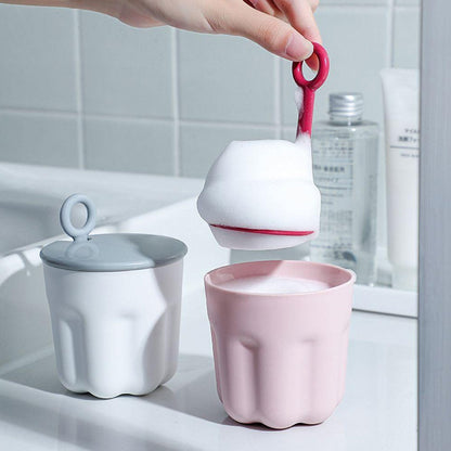 The Foaming Cleanser Shaker disassembled, showing its easy-to-clean components for hygienic use.
