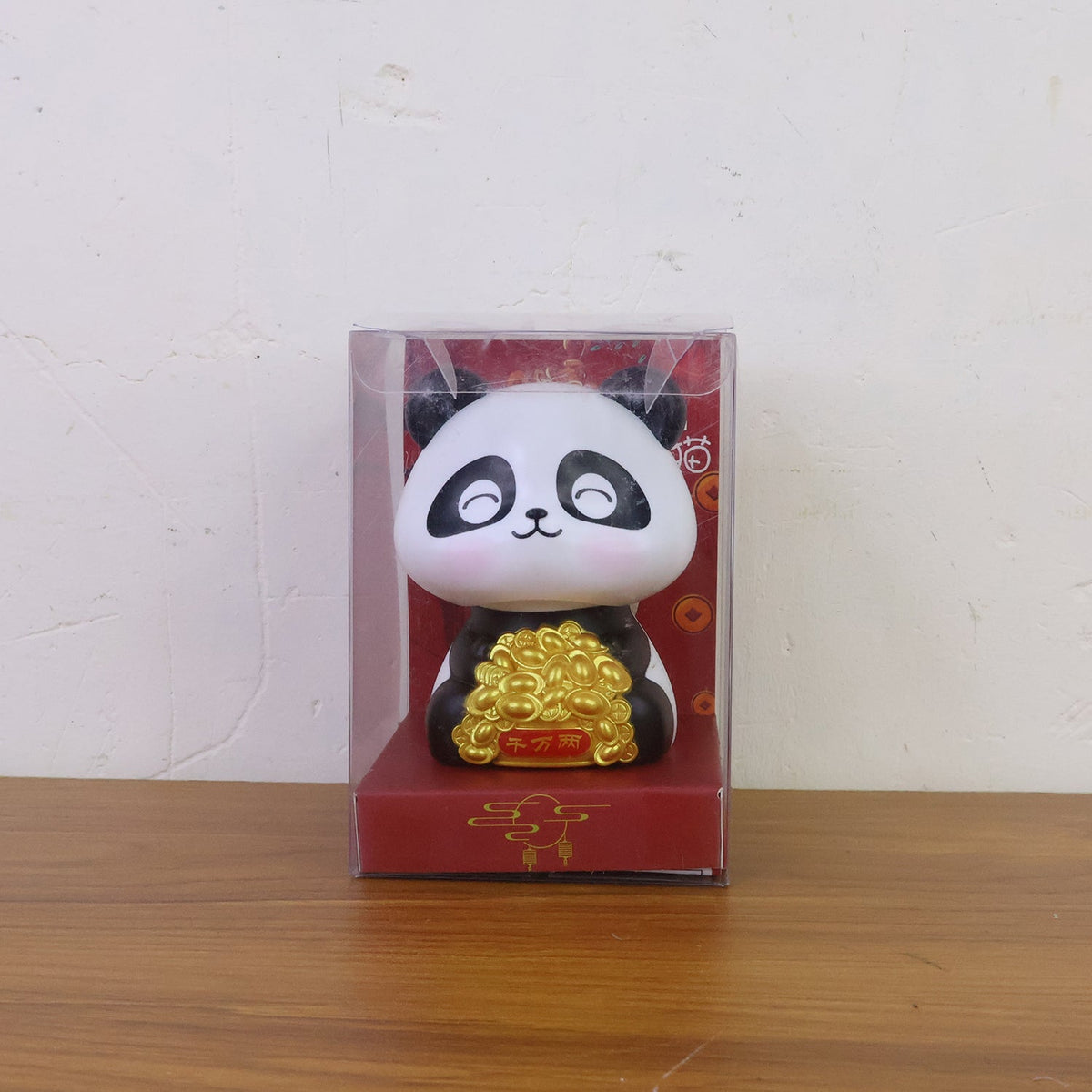 Multiple solar panda figurines in various poses, emphasizing their charm as car interior accessories.