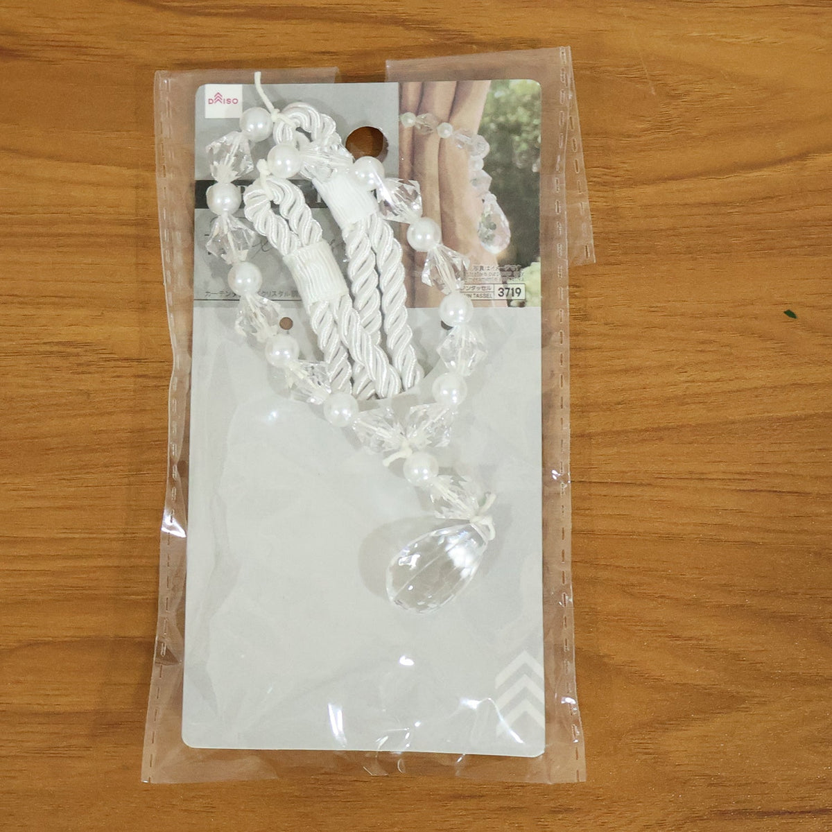 Fancy crystal curtain strap with teardrop pendant detail