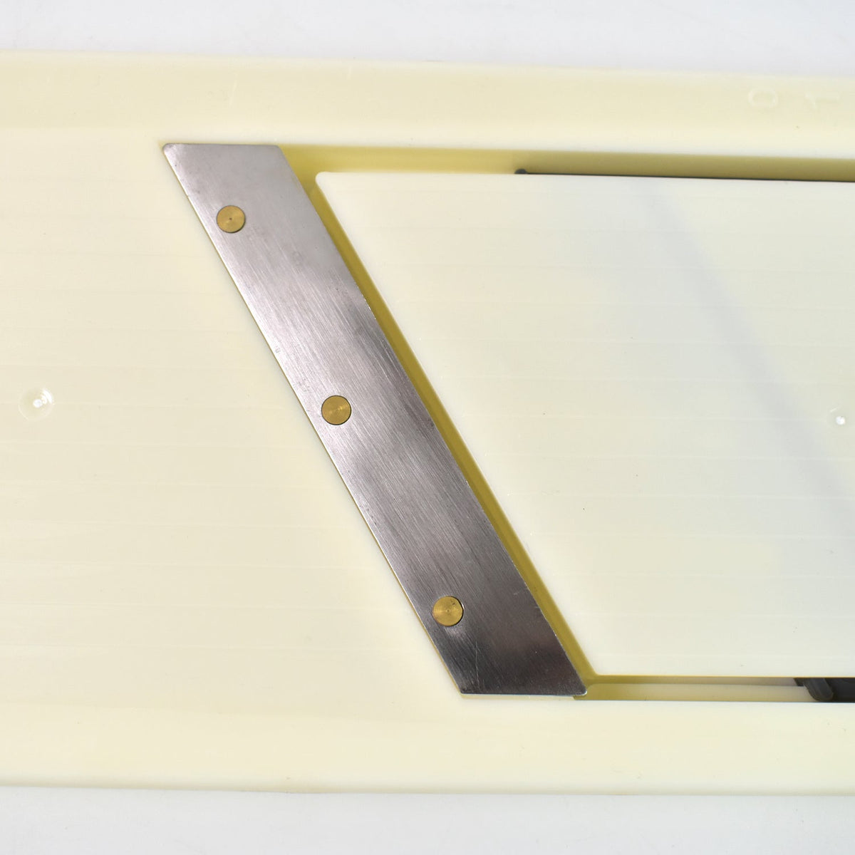 Detail of the ergonomic handle providing a comfortable grip for the user.