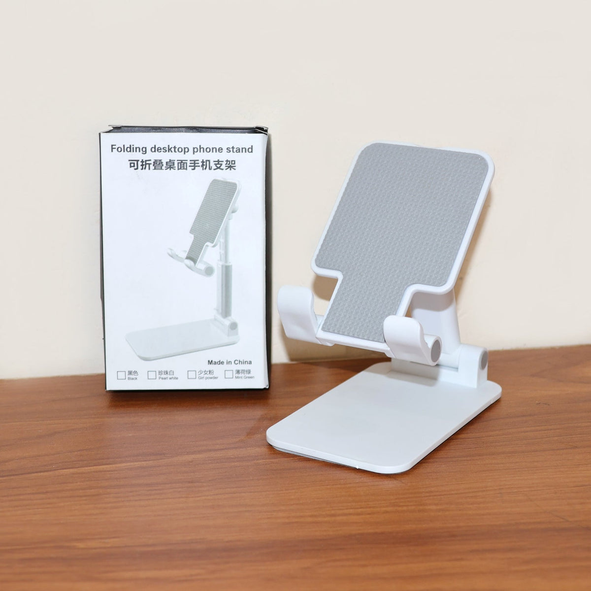 Portable foldable desktop mobile phone holder providing stable support