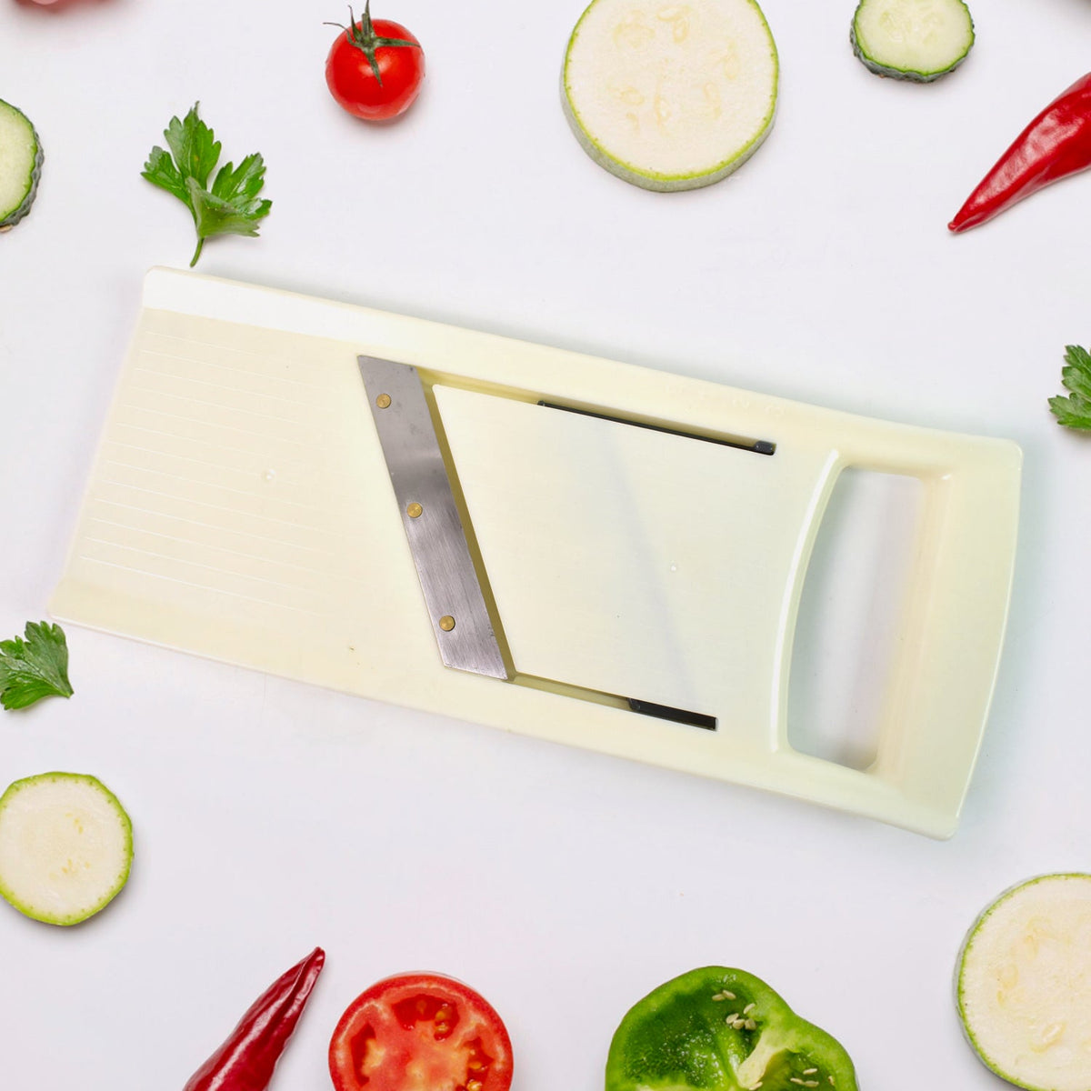 Top-down view of the fruit slicer kitchen tool showcasing its ergonomic design.