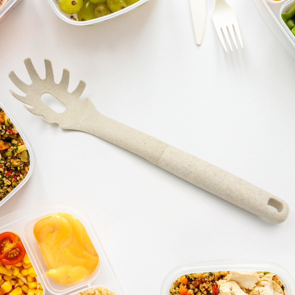 Overhead view of the versatile plastic pasta fork, perfect for serving spaghetti and long noodles.