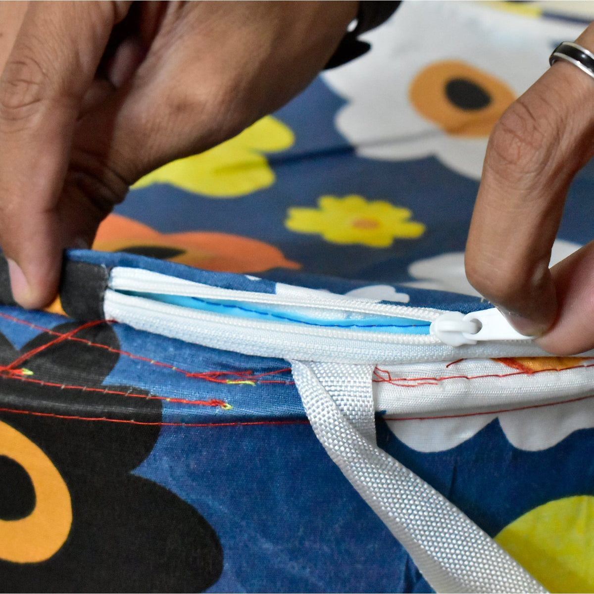 A full canvas laundry bag ready for wash day, demonstrating its utility.