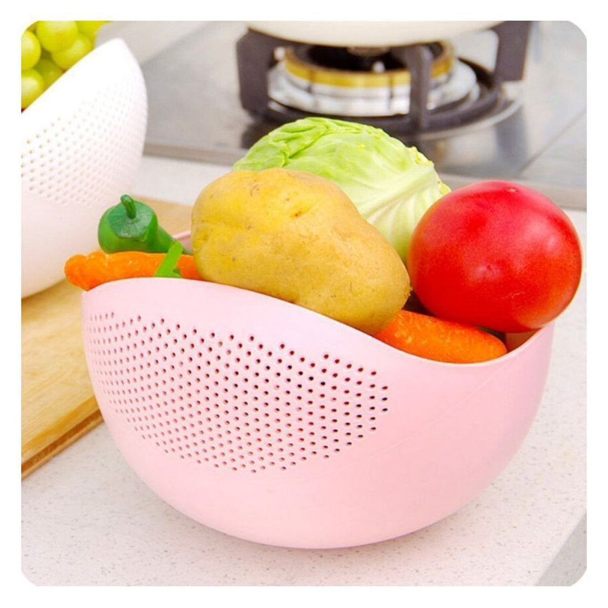 Plastic rice strainer bowl with a handle for washing and draining rice.