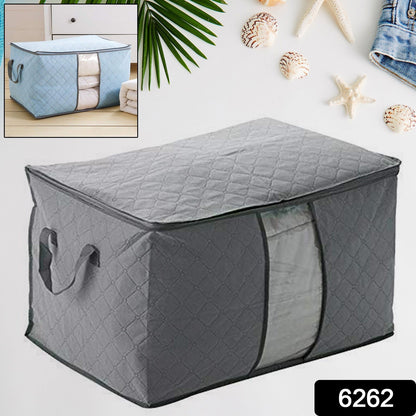 Foldable storage bag filled with blankets, showcasing its spacious capacity.