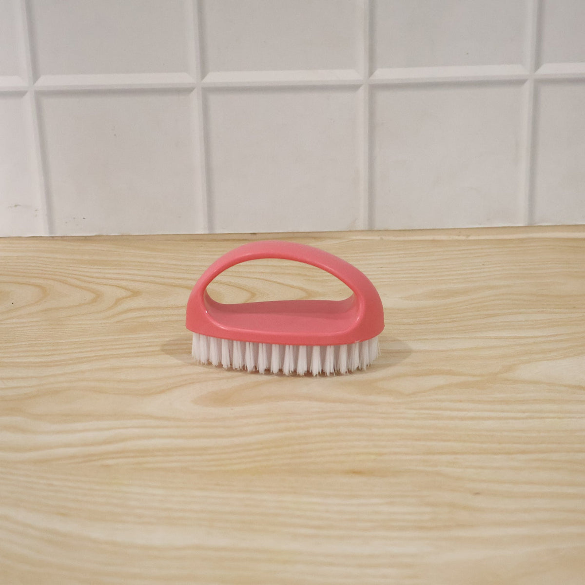 Person using multi-purpose cleaning brush on surface for deep cleaning