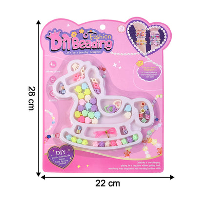 Craft kit beads and charms arranged for children's DIY jewellery projects