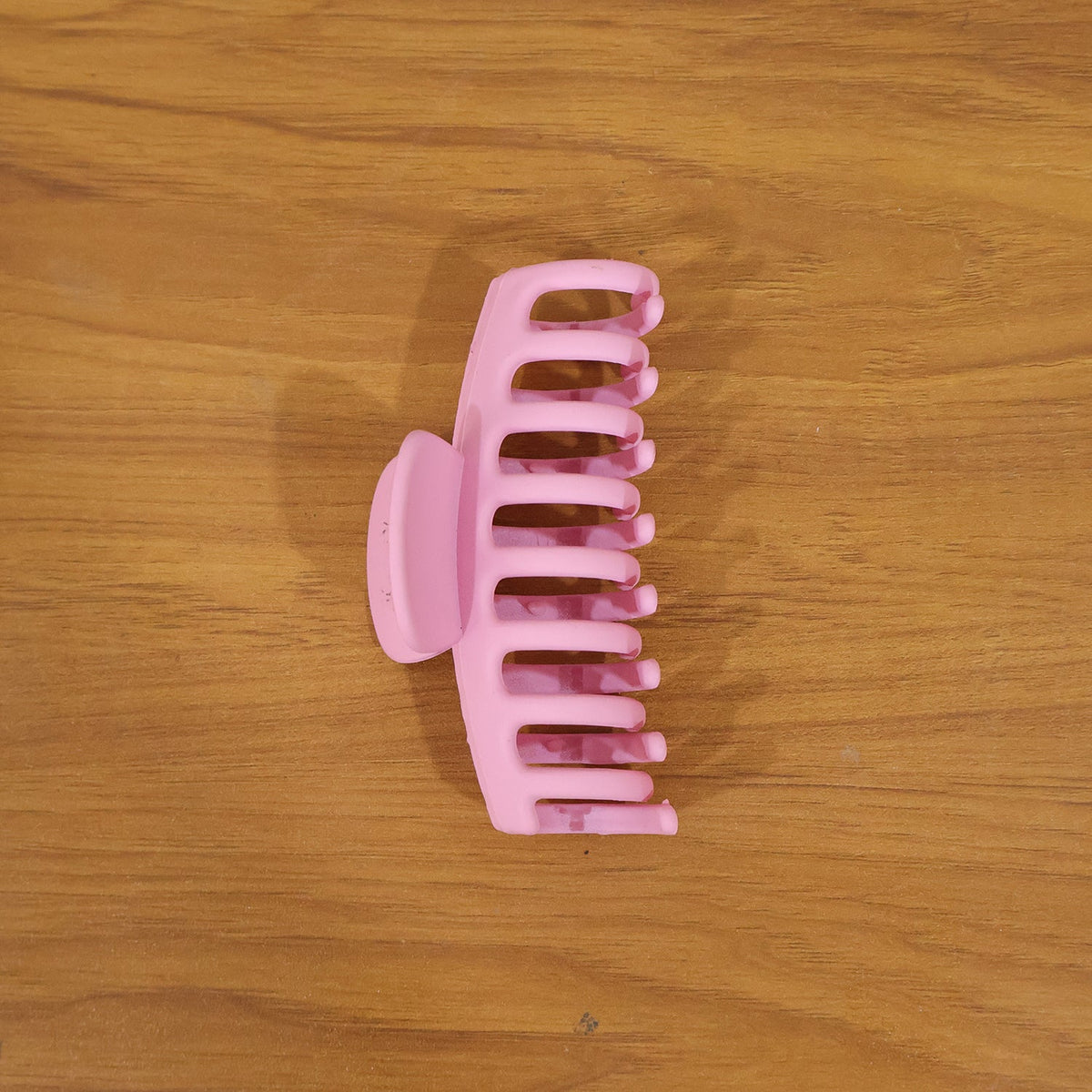 Model wearing elegant pink hair claw clip in styling