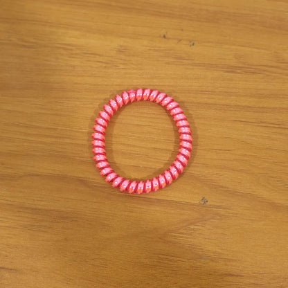 Strong elastic hair coil band for secure ponytails and buns