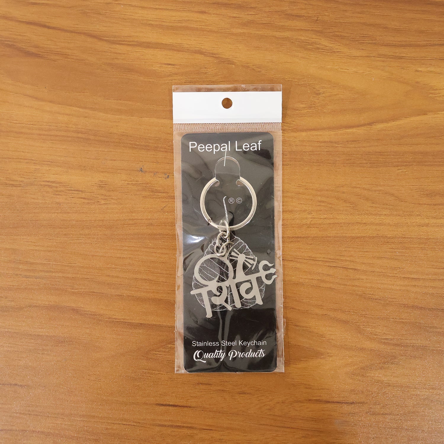 Shiv design metal keychain in hand