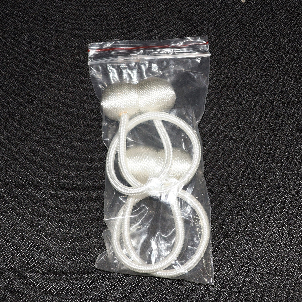 Elegant magnetic curtain tiebacks in a home setting, styling a window.