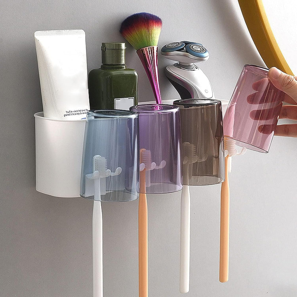 Bathroom toothbrush storage rack mounted on wall with organized sections