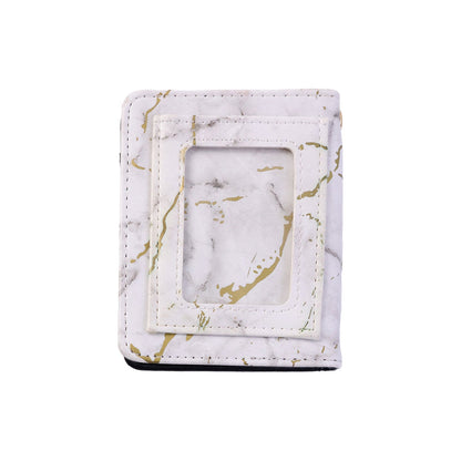 Compact card holder wallet featuring marble texture and snap closure