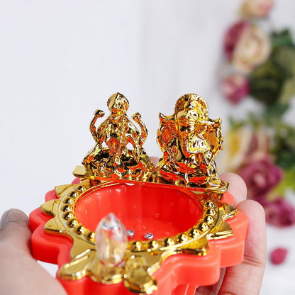 LED lighted Lakshmi Ganesh pooja diya emitting warm decorative glow