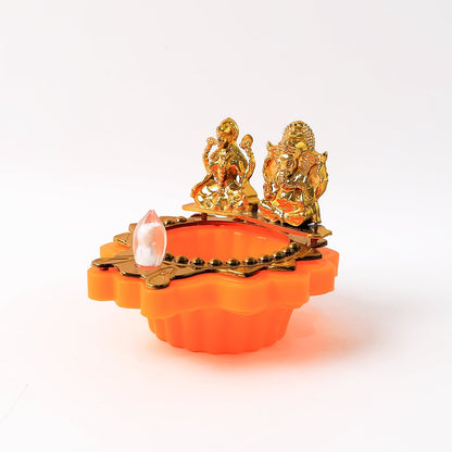 Golden Laxmi Ganesh LED lighted diya placed on a lotus base