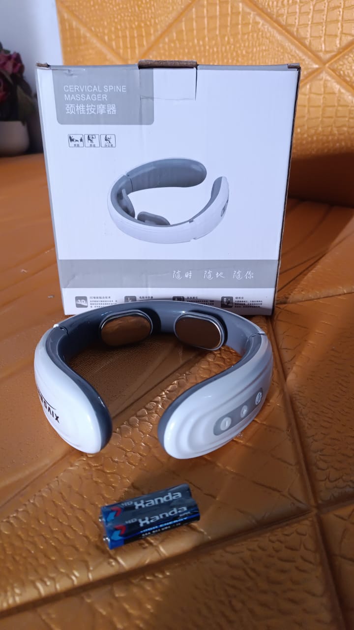 Compact electric neck and back massager device in use