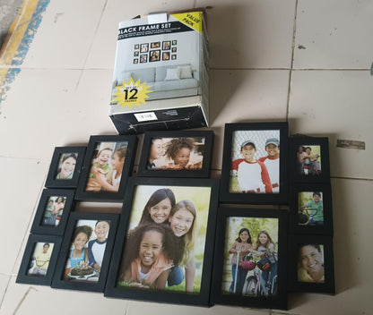 Close view of black photo frame set protecting artwork with acrylic fronts